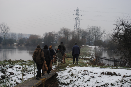 With special permission from the BTO, we can run our duck traps in severe weather because the water does not freeze and we bait the duck traps with grain - a welcome meal for hungry ducks! (Sally Harris) Duck trap checking, Feb 2012